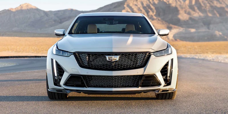 White Cadillac CT5-v sedan at desert backdrop