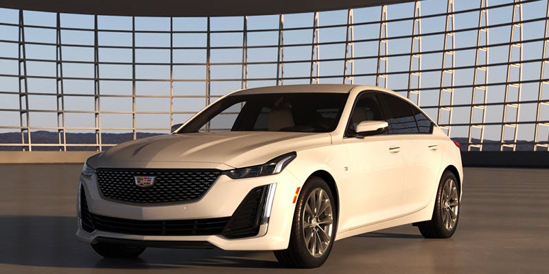 A CT5 standing on road front of abuildings