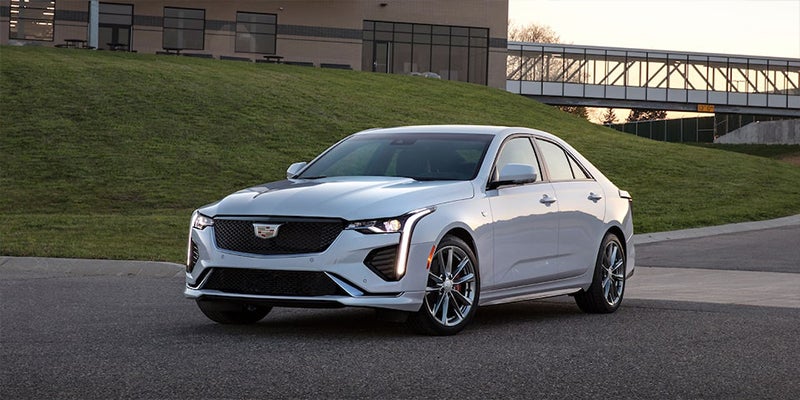 White CT4 parked near lown