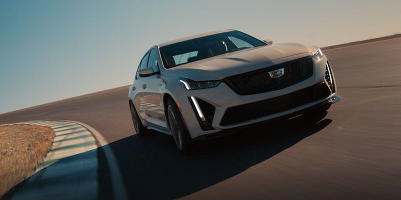 A White CT5 running on the road