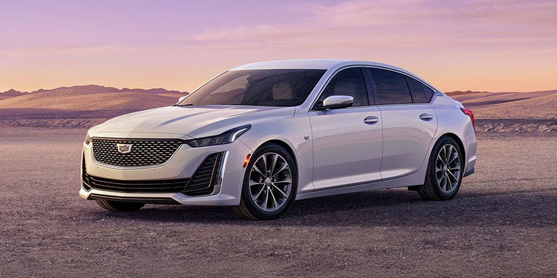 White Cadillac CT5 sedan at sunset desert backdrop